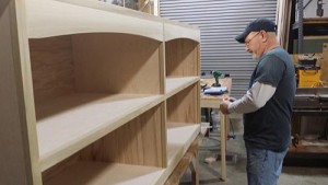 David Lloyed hand building a shelf